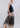 Side view of beige midi skirt showing fluid drape, elastic waist and refined baroque damask print