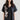 Front view of Psophía cotton poplin shirt with vintage-inspired notch collar, elbow-length sleeves, and side embroidery.