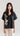 Front view of Psophía cotton poplin shirt with vintage-inspired notch collar, elbow-length sleeves, and side embroidery.