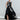 Psophía embroidered poplin dress with sequins and layered ruffle skirt, blending structure and fluid movement.