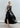 Psophía embroidered poplin dress with sequins and layered ruffle skirt, blending structure and fluid movement.
