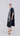 Side view of Psophía poplin midi dress highlighting the slightly flared cut, softly defined waist, and side button closure inspired by the cheongsam design