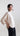 Side view of Psophía relaxed-fit bomber jacket showing wide sleeves, elastic hem and modern silhouette