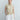 Psophía SS26 bi-color sleeveless dress with adjustable funnel neck, sculptural silhouette and clean architectural contrast