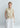 Psophía SS26 bi-color sleeveless dress with adjustable funnel neck, sculptural silhouette and clean architectural contrast
