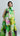 Psophía SS26 Bloomlight midi dress with neck tie, painterly floral print and fluid silhouette with an artistic feel.
