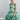 Botanic Soft Flow dress Psophía SS26 front view with asymmetrical overlay, square neckline and fluid silhouette