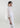 Side view of Camelia blouse highlighting its straight silhouette and delicate embroidered details.