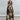 Psophía SS26 Orient Contour plunge halter dress in luxurious silk with stylized floral print and flowing silhouette