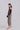 Side view of the Savanna Shadow slouchy pants showing relaxed silhouette, soft drape and subtle volume.