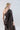 Back view of asymmetric mercerized cotton T-shirt with clean lines and contemporary relaxed structure.