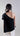Back view of asymmetric mercerized cotton T-shirt with clean lines and refined contemporary structure.
