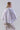 Back view of Psophía baroque ruffle poplin shirt with clean structure and flowing cape-style sleeves.