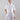 Front view of a short-sleeve cotton bolero with small collar, front button closure and functional chest pockets.