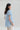 Back view of cotton oxford shirt with extended back hem and clean relaxed lines.