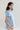 Side view of cotton oxford shirt highlighting gathered shoulders and fluid hemline.