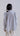 Back view of cotton oxford shirt with curved hem and soft relaxed drape for balanced silhouette.
