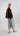 Back view of Psophía SS26 women’s bomber jacket with a slightly longer rounded hem, enhancing proportion and modern elegance.