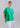 Front view of drawstring side-gathered mercerized cotton T-shirt with relaxed fit, rounded hem, and adjustable side drape.