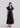 Side view of Psophía SS26 women’s poplin maxi dress highlighting the fluid movement of the skirt and the elegant volume of the puff sleeves
