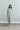 Front view of Psophía SS26 women’s Fluid Midi Dress in sheer organza, featuring a loose fluid silhouette, short sleeves, clean shirt collar and delicate floral appliqué details for contemporary women’s fashion.