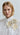 Lookbook image of a sheer organza blouse with floral appliqué, styled with high-waisted pieces for a contemporary spring–summer outfit with a serene and elegant aesthetic.