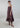 Psophía SS26 women’s Lunar Breeze flowy slip dress with micro polka dots, adjustable tie straps, and a fluid silhouette with volant hem.