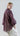 Side view of Psophía SS26 women’s Lunar Breeze blouse highlighting the rounded hem and controlled volume of the puff sleeves with triple cuffs.