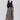 Mini gingham wide-leg pants with drawstring waist shown from the front, highlighting relaxed fit and fluid silhouette.