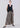 Mini gingham wide-leg pants with drawstring waist shown from the front, highlighting relaxed fit and fluid silhouette.