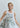 Women’s muted peony sleeveless round-neck top styled with relaxed oversized silhouette and subtle side points.