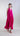 Front view of rayon silk halter maxi dress with clean neckline and softly flowing asymmetric skirt.