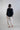 Back view of soft volume relaxed pants with elastic waist and rounded silhouette