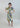 Front view of Psophía boat-neck dress showing floral marigold print and adjustable ribbon sleeve detail.