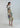 Side view of Psophía midi dress with straight silhouette and large-scale 70s-inspired floral print