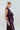 Side view of the taffeta wrap top showing the ruffle detail, structured drape and defined waist